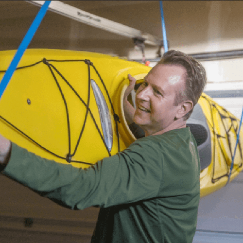 Rob, a real Breyanzi patient, with a kayak.